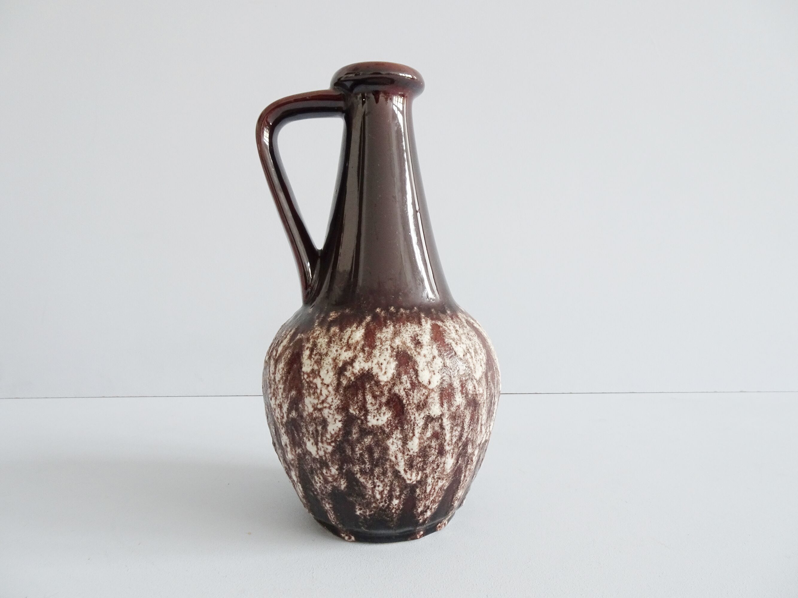 Bay ceramic pitcher with handle and fat lava glaze