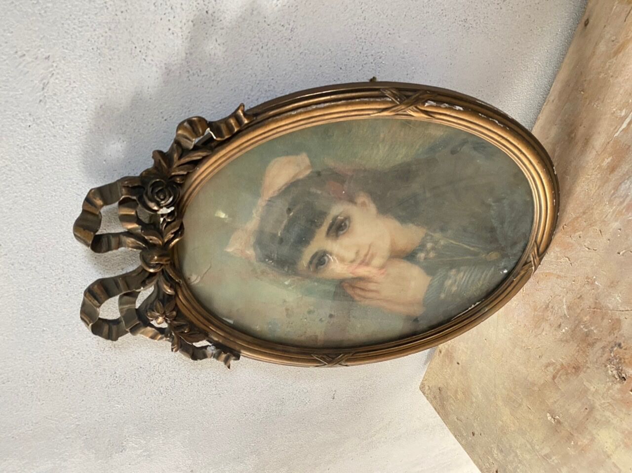 Portrait of a young girl in pastel and beautiful oval frame