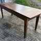 Antique chestnut farmhouse table with 3 drawers on the front.