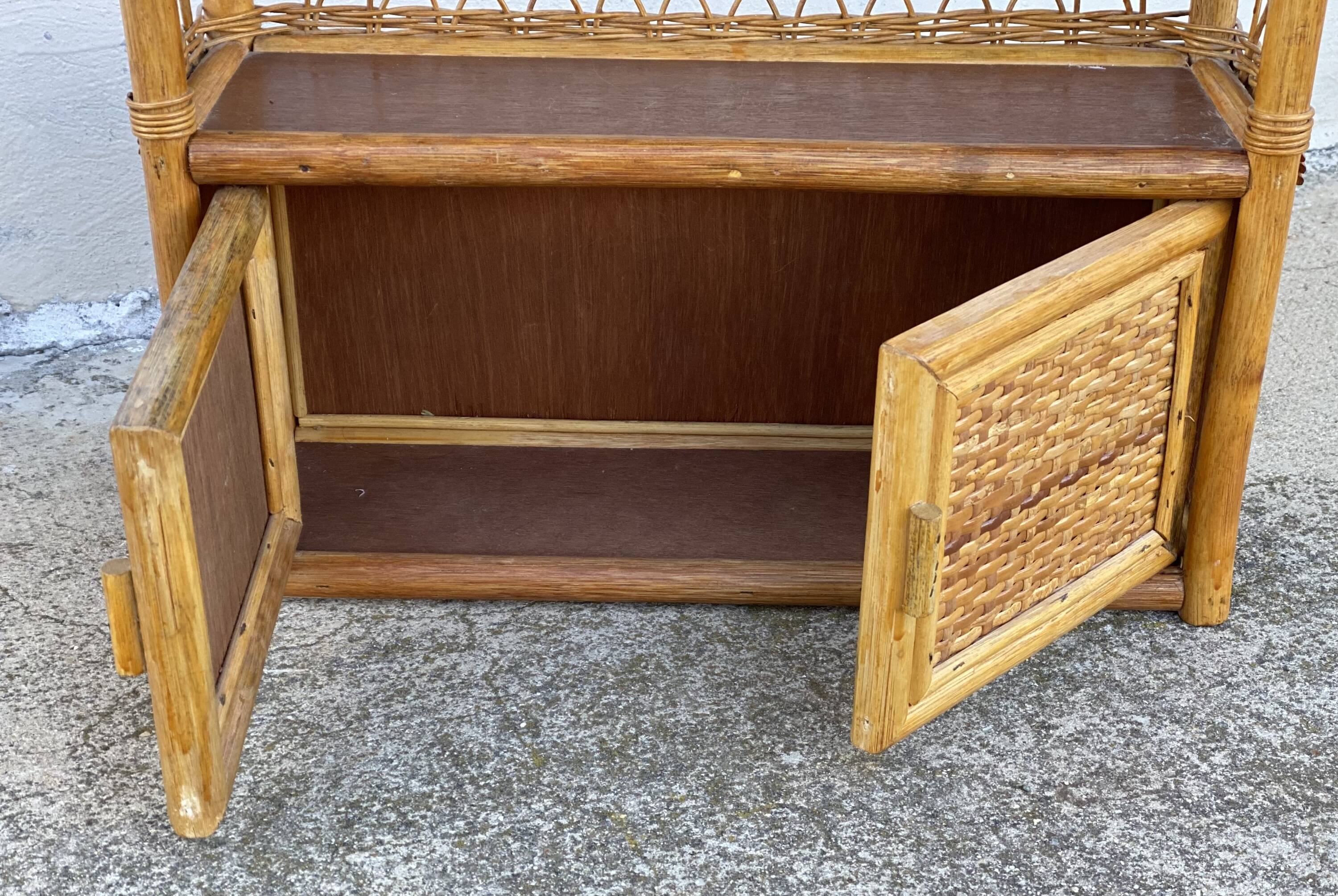 Small vintage 1970s rattan wall shelf with 2 doors.