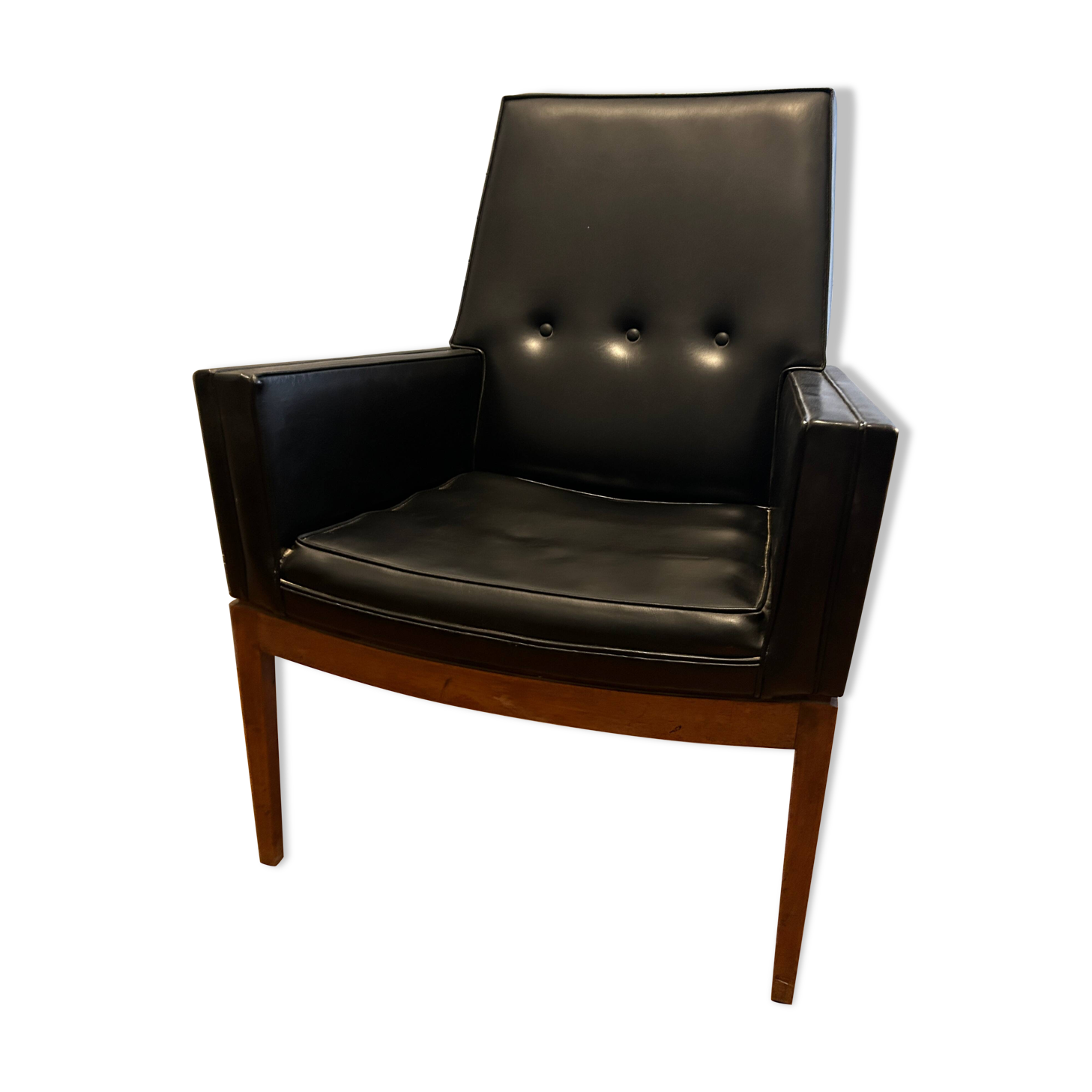 Modernist armchair in wood and black synthetic leather, circa 1960