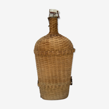 Lourdes pilgrimage bottle covered with wicker