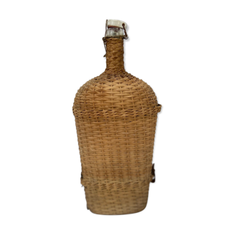 Lourdes pilgrimage bottle covered with wicker