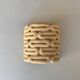 Handcrafted ceramic wall light in raw stoneware inspired by Mid Century design.