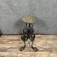 Wrought iron candlestick on four-legged base circa 1900-1930