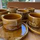 6 stoneware cups and 6 enamel plates