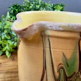 Large vintage ceramic pitcher with abstract green and brown decoration.