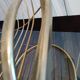 Tubular metal chair covered with gilding
