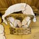 1960s wicker cradle with mattress and drapes.