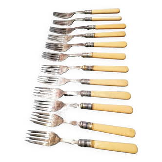 Old silver fish forks with bone handles