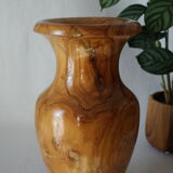 Artisanal vase in wood turned from varnished olive tree