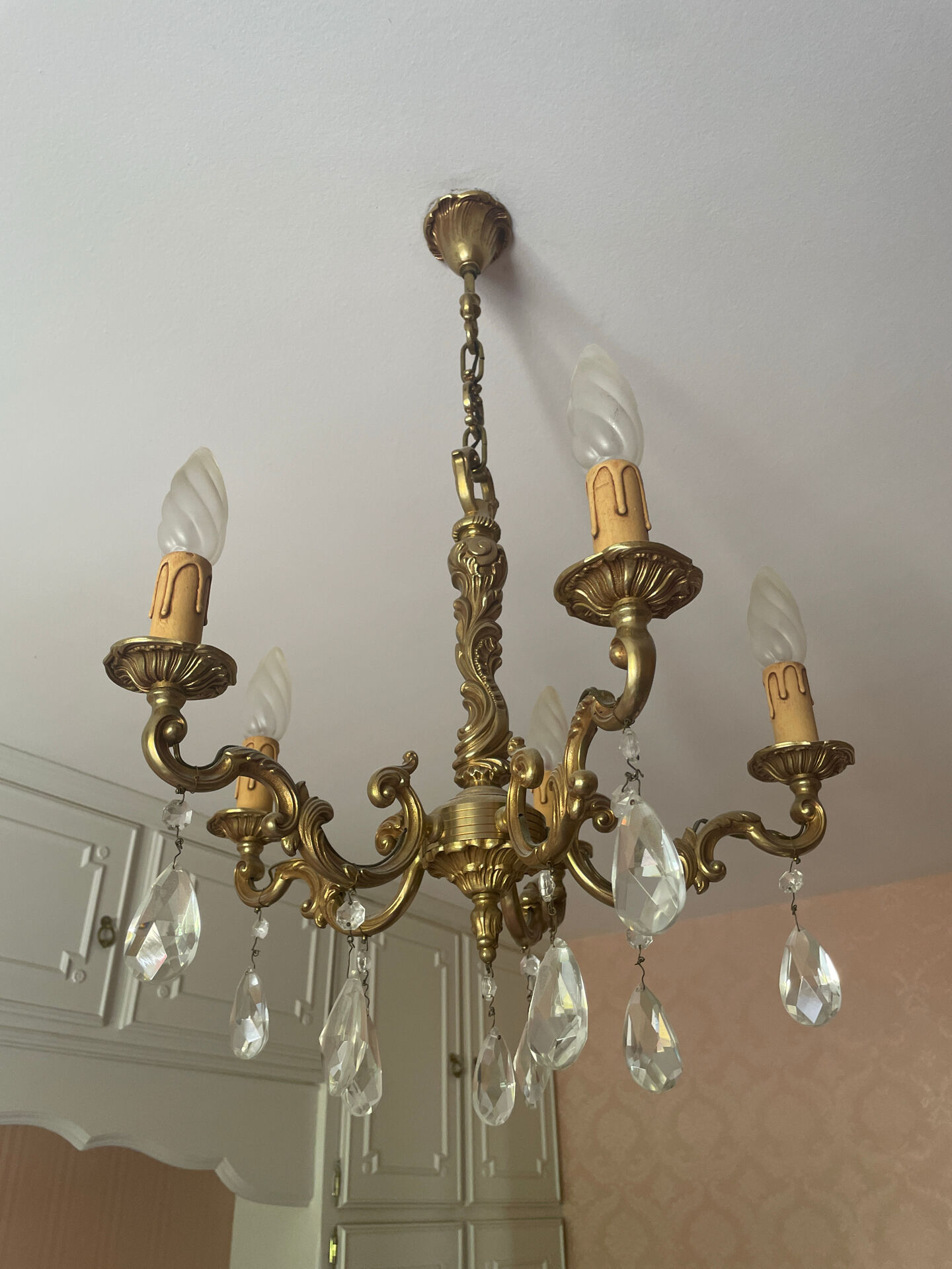 Magnificent bronze chandelier with pendants.