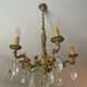 Magnificent bronze chandelier with pendants.