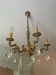 Magnificent bronze chandelier with pendants.