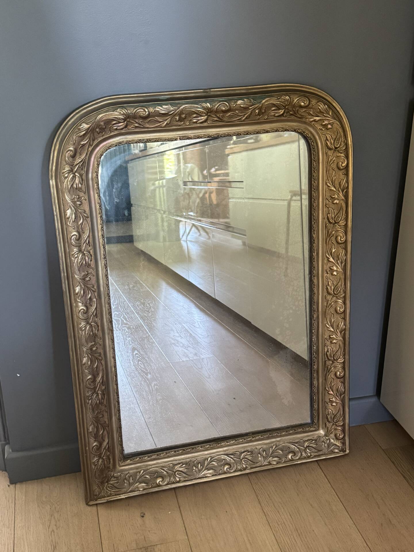 Golden mirror with mouldings