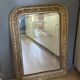 Golden mirror with mouldings