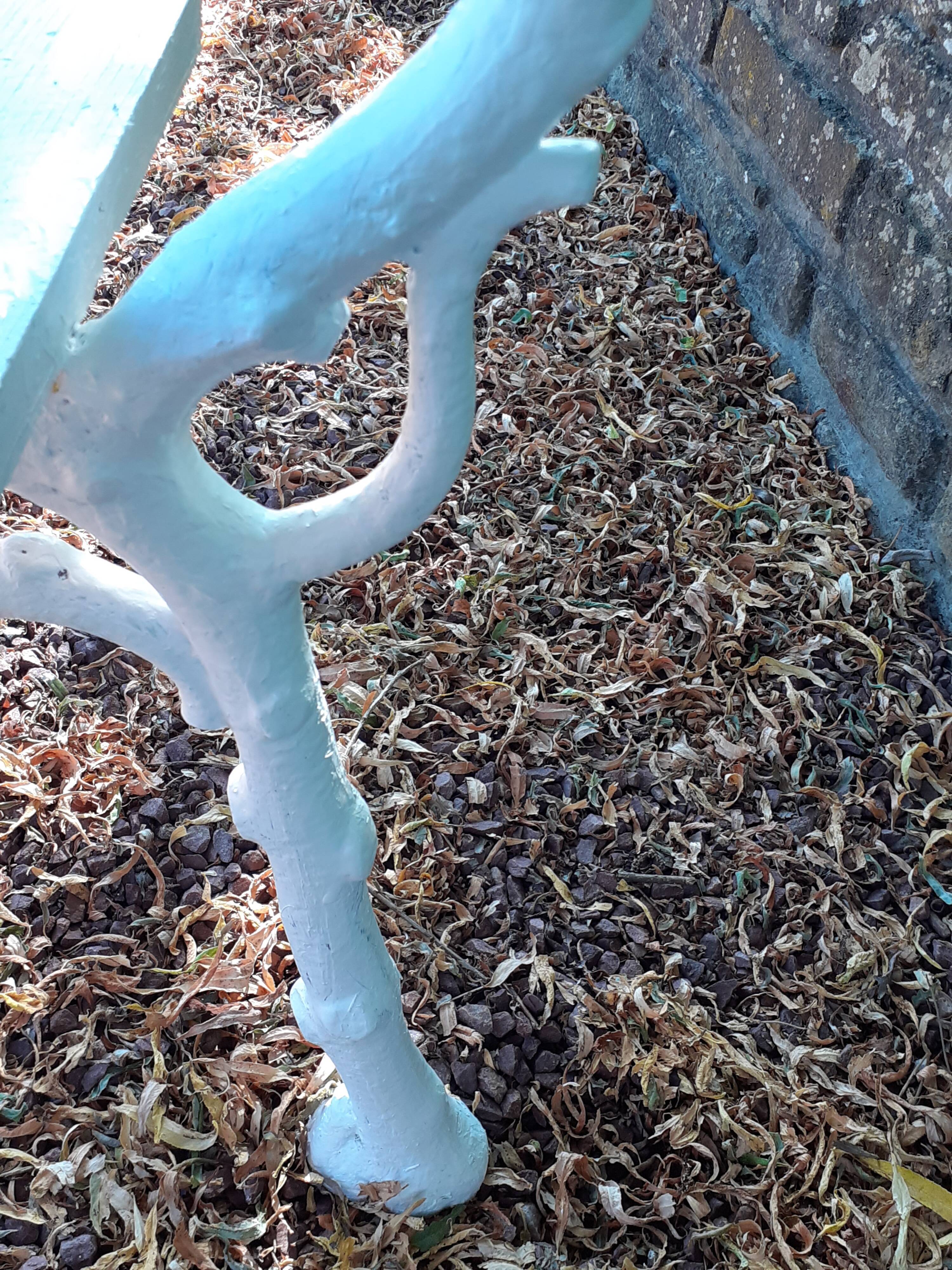 Old garden bench with cast iron feet and wooden planks