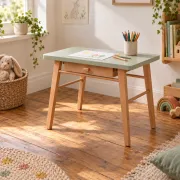 Small vintage children's desk attributed to Baumann – natural wood and lizard green top.