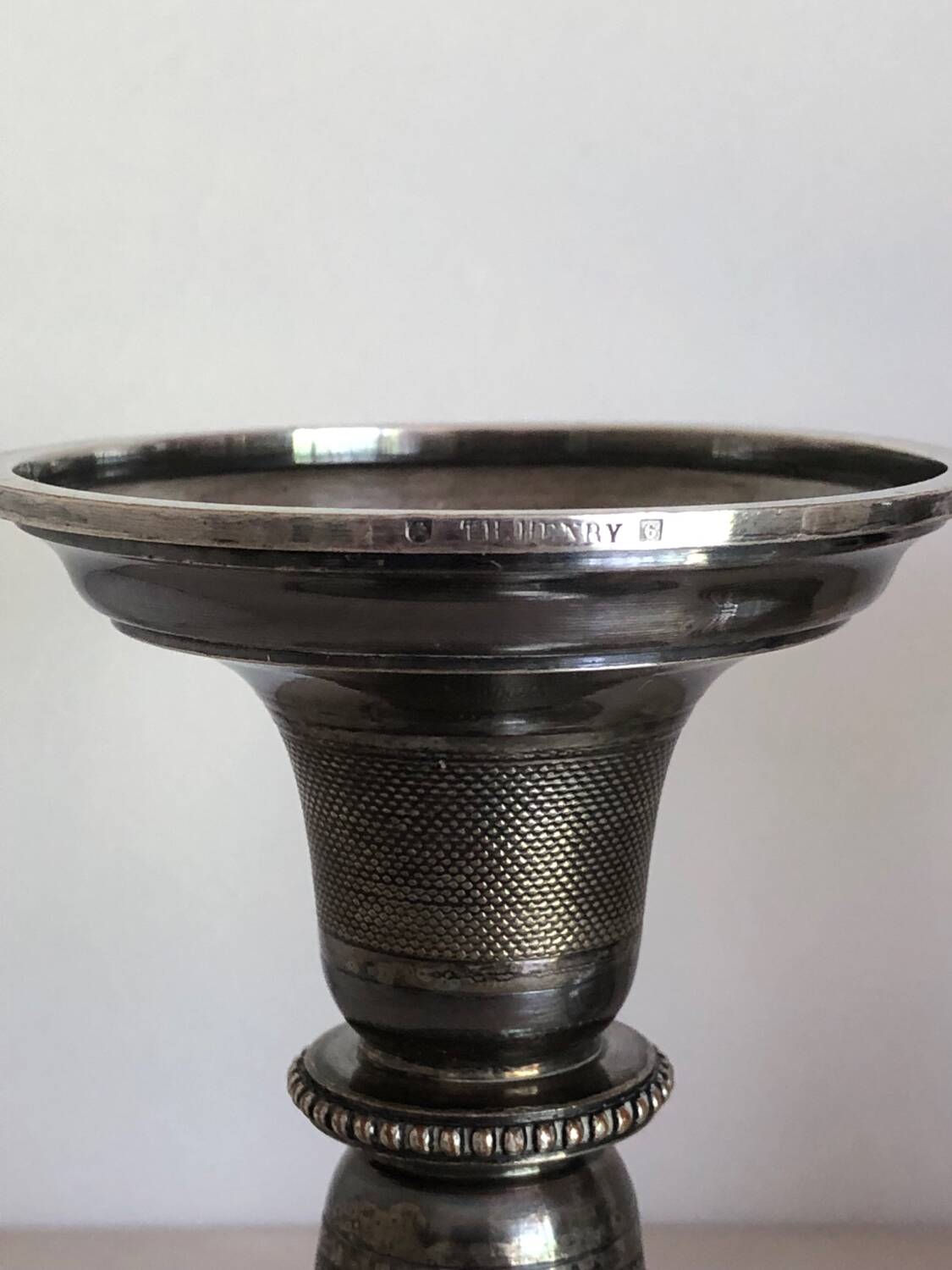 Silver candlesticks by TH HENRY