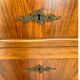 Antique walnut commode with bronze handles in the shape of a lion's mask,