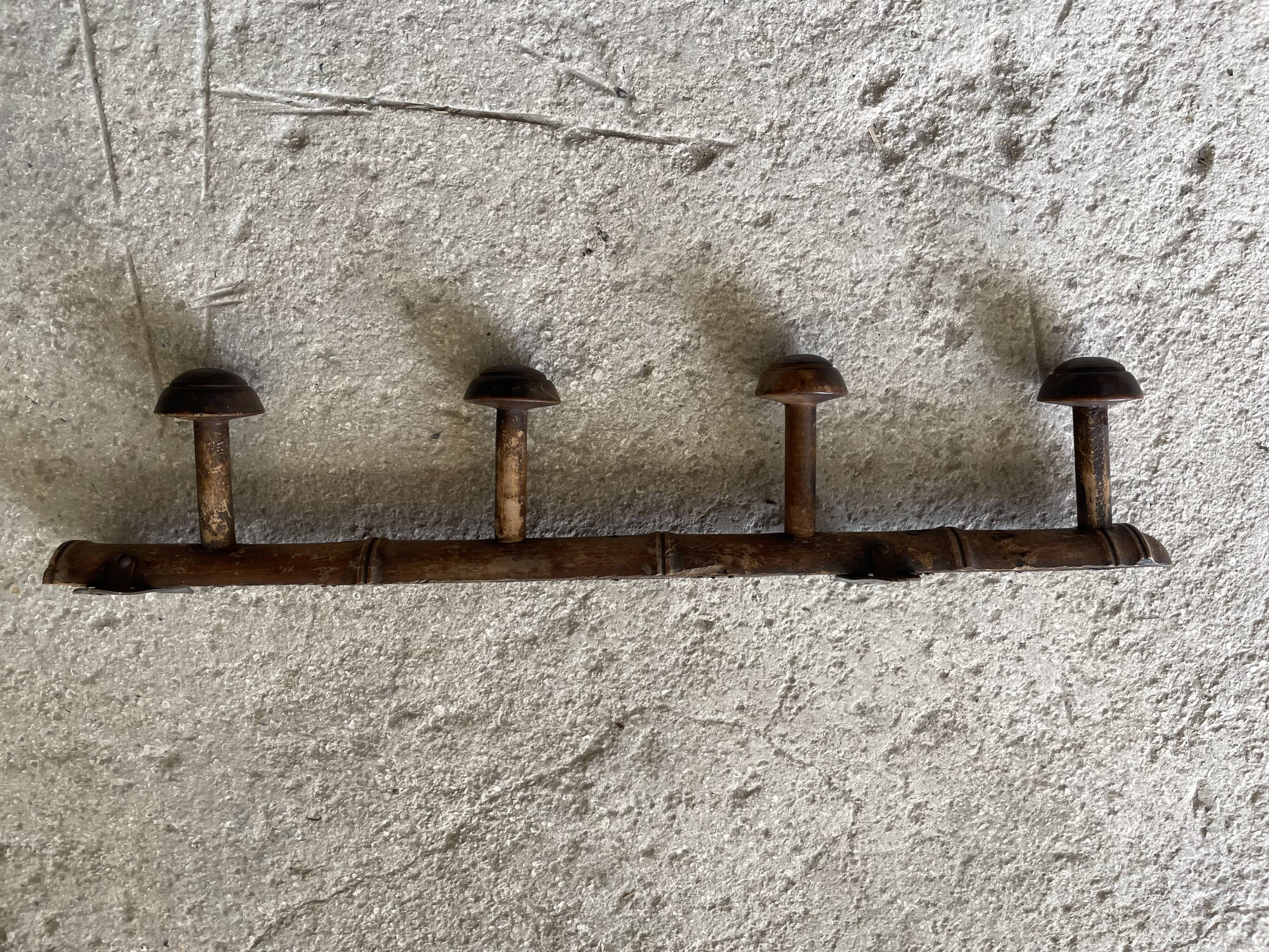 Old wooden wall coat rack