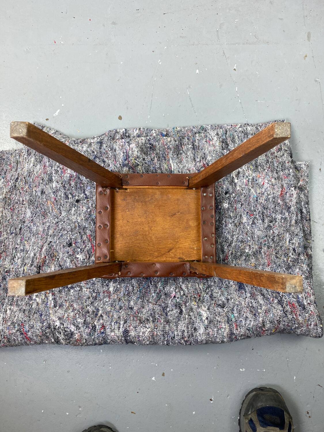 Small stool or footrest in wood and leather