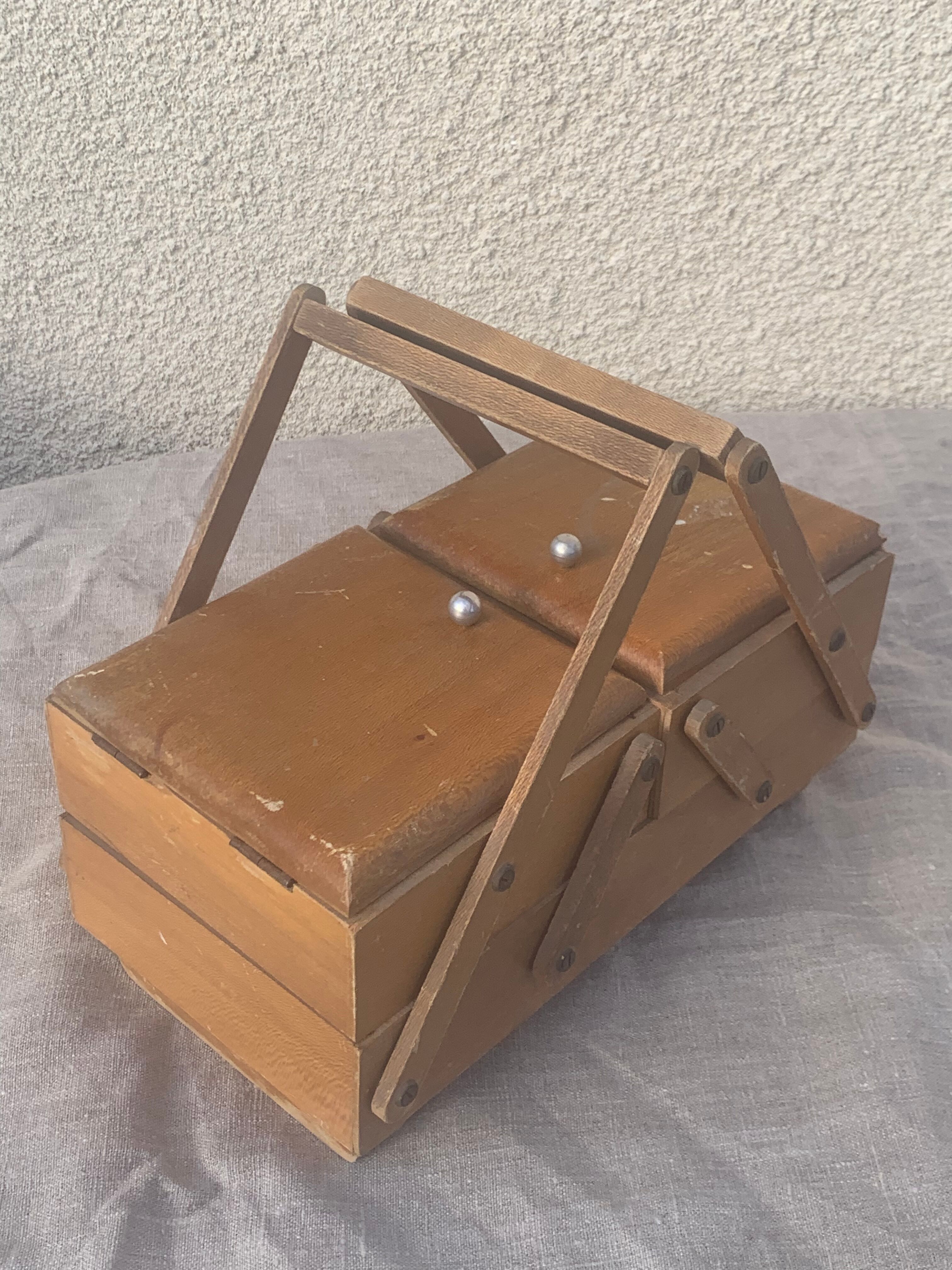 Sewing box in old varnished wood