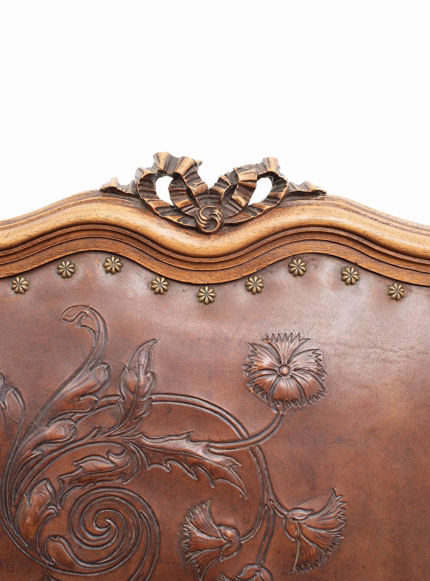 Set of 4 Louis XVI style chairs in carved wood and embossed leather.