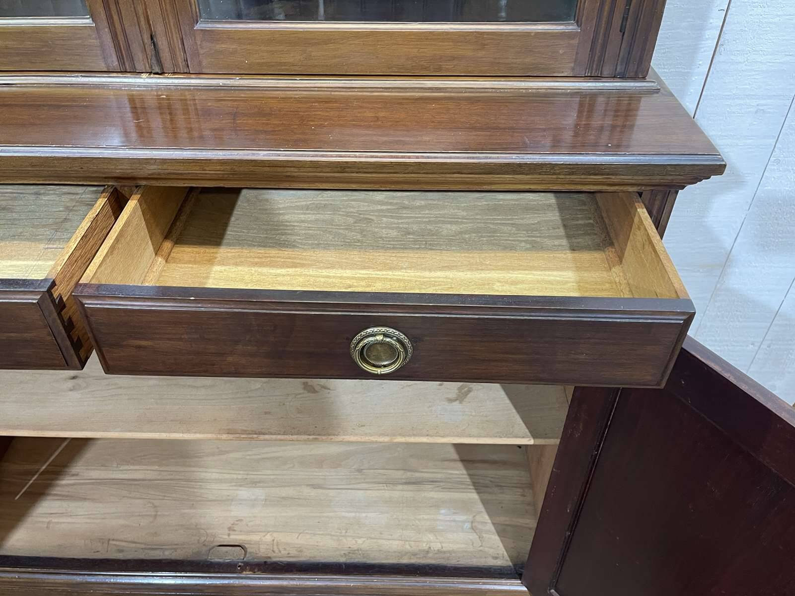 English walnut two-body library from the early 20th century.