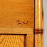 Small storage unit in cane and wood.