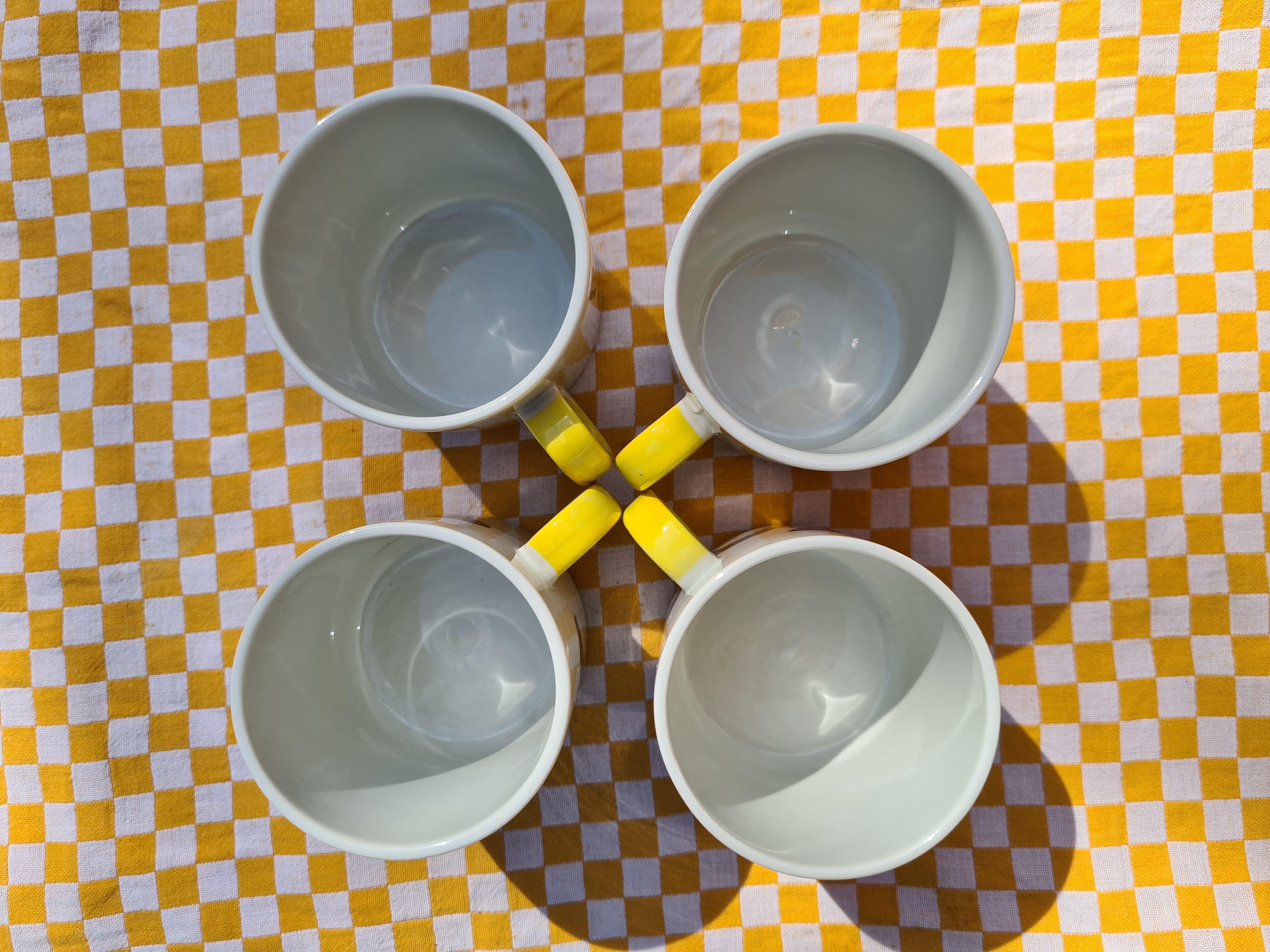 Four mugs decorated with Villeroy and Boch butterflies