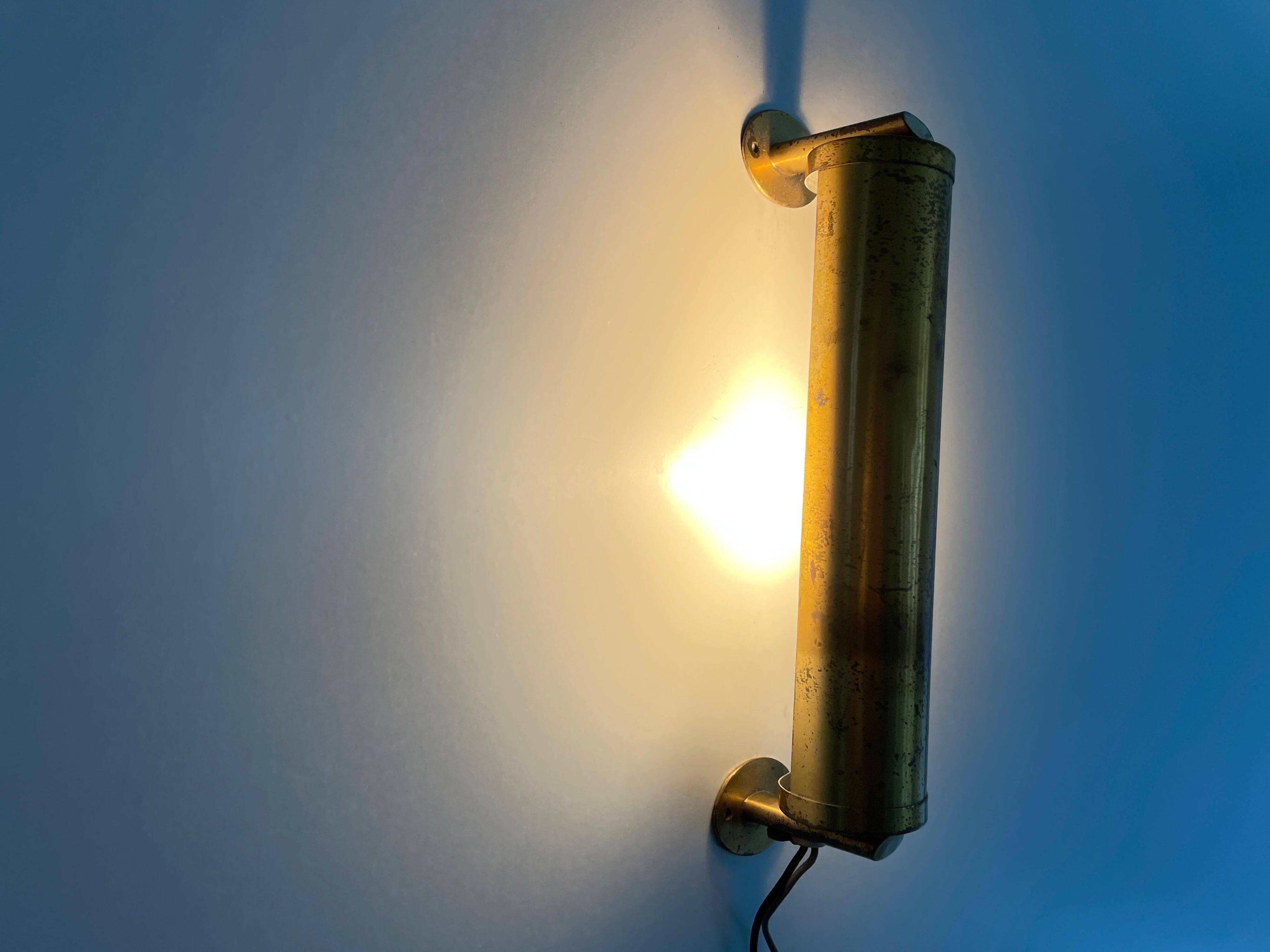 Small simple cylindrical brass wall light from the mid-century, 1950s, Germany.