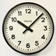 Black swiss industrial wall clock from inducta, 1960s