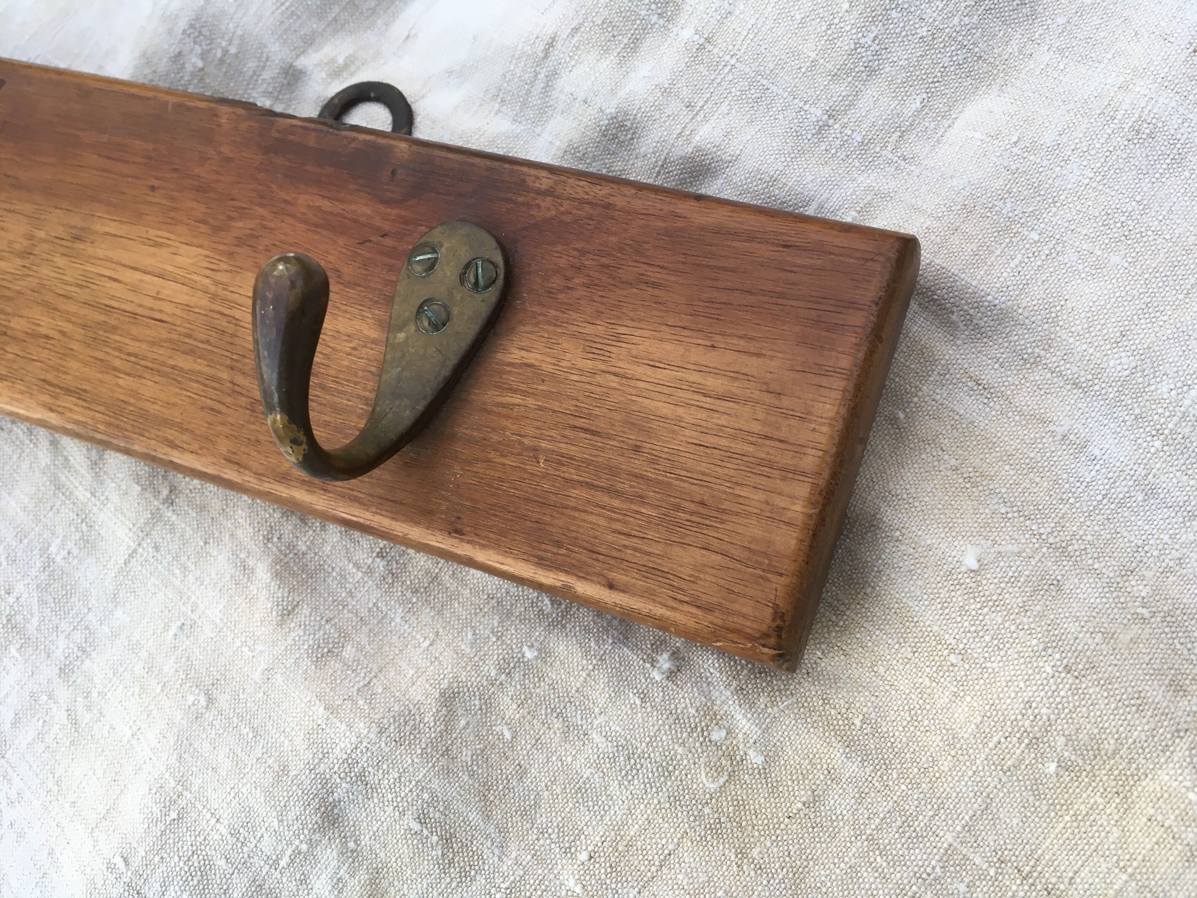 Wall hook from wood and brass