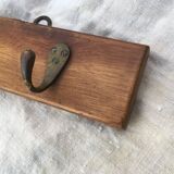 Wall hook from wood and brass