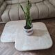 Pair of travertine nesting tables