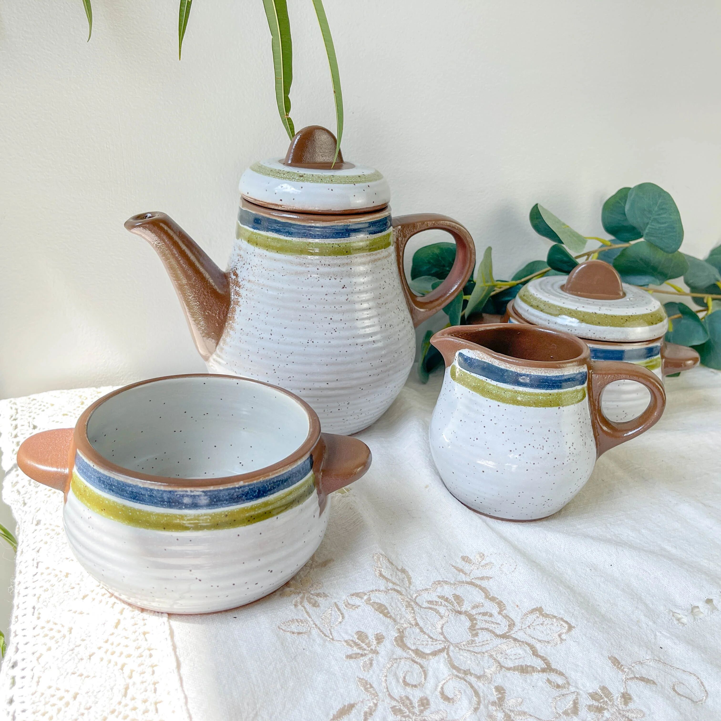 Vintage 1950s speckled stoneware coffee set with grey, green, and blue stripes