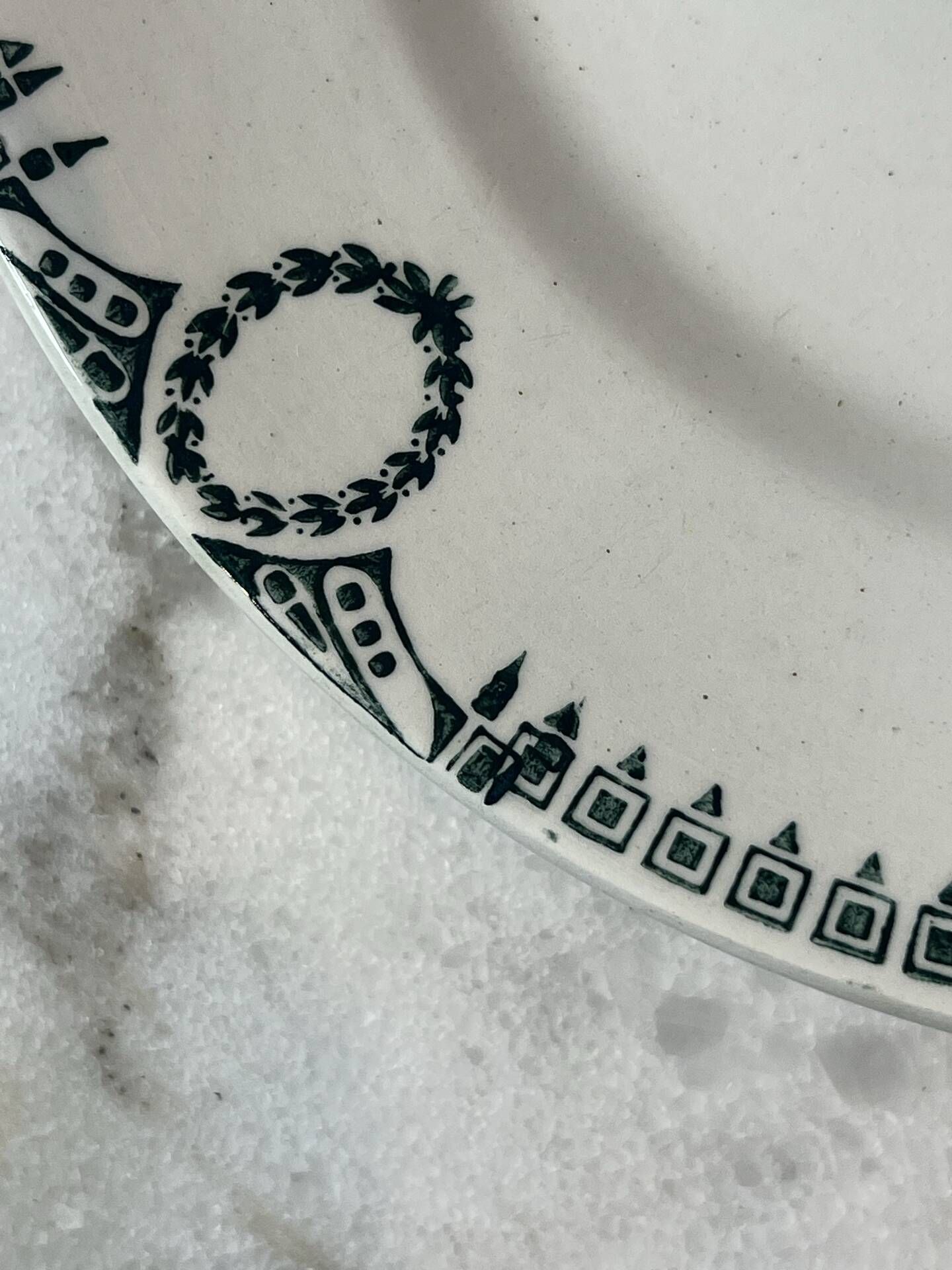Set of 2 Saint Amand plates with laurel crown decoration.