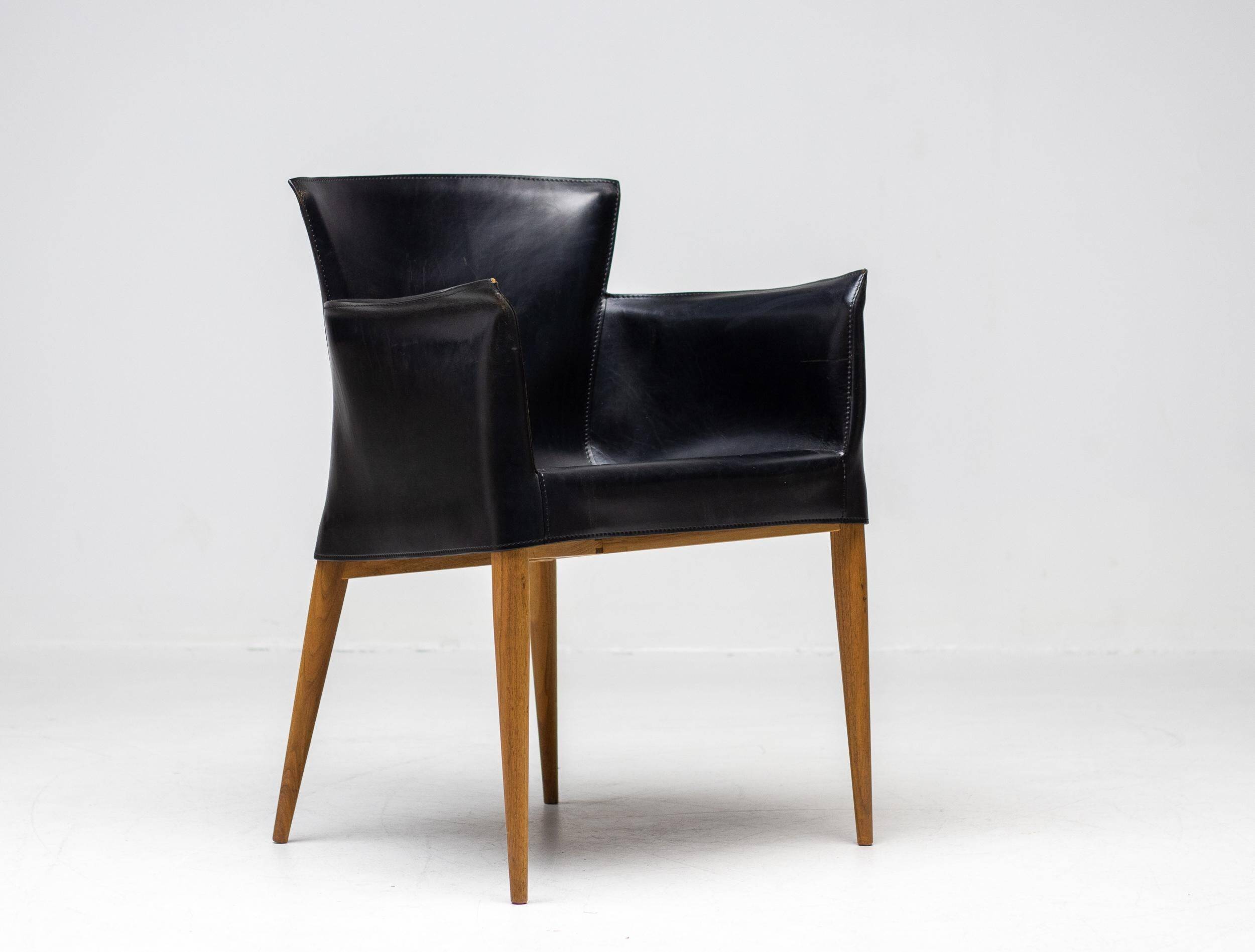 Set of four Vela leather armchairs by Carlo Bartoli - Italian modern elegance.
