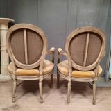 Pair of Louis XVI style medallion armchairs