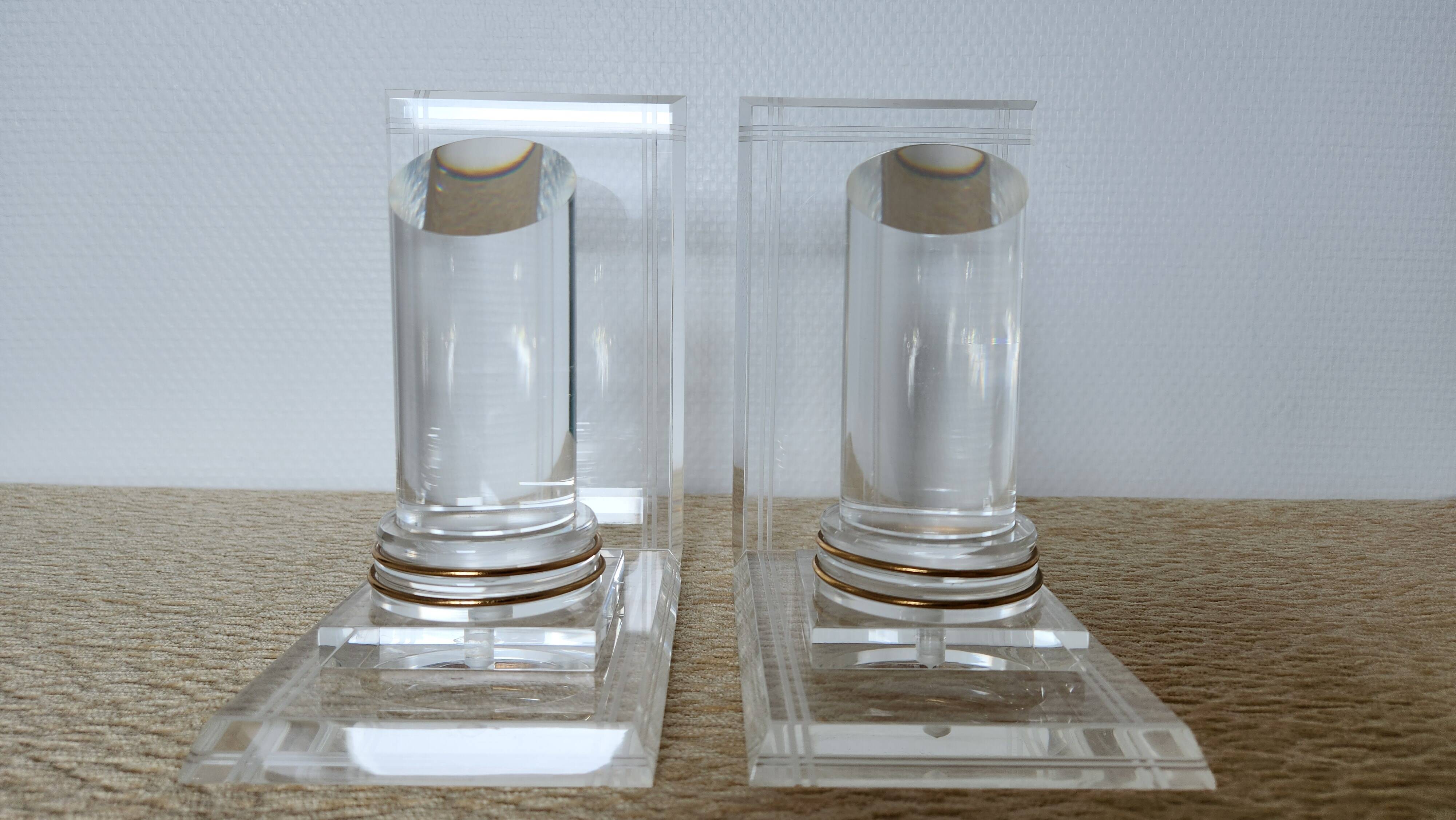 Pair of column bookends in plexiglass and gold metal, 1980s design.