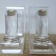 Pair of column bookends in plexiglass and gold metal, 1980s design.