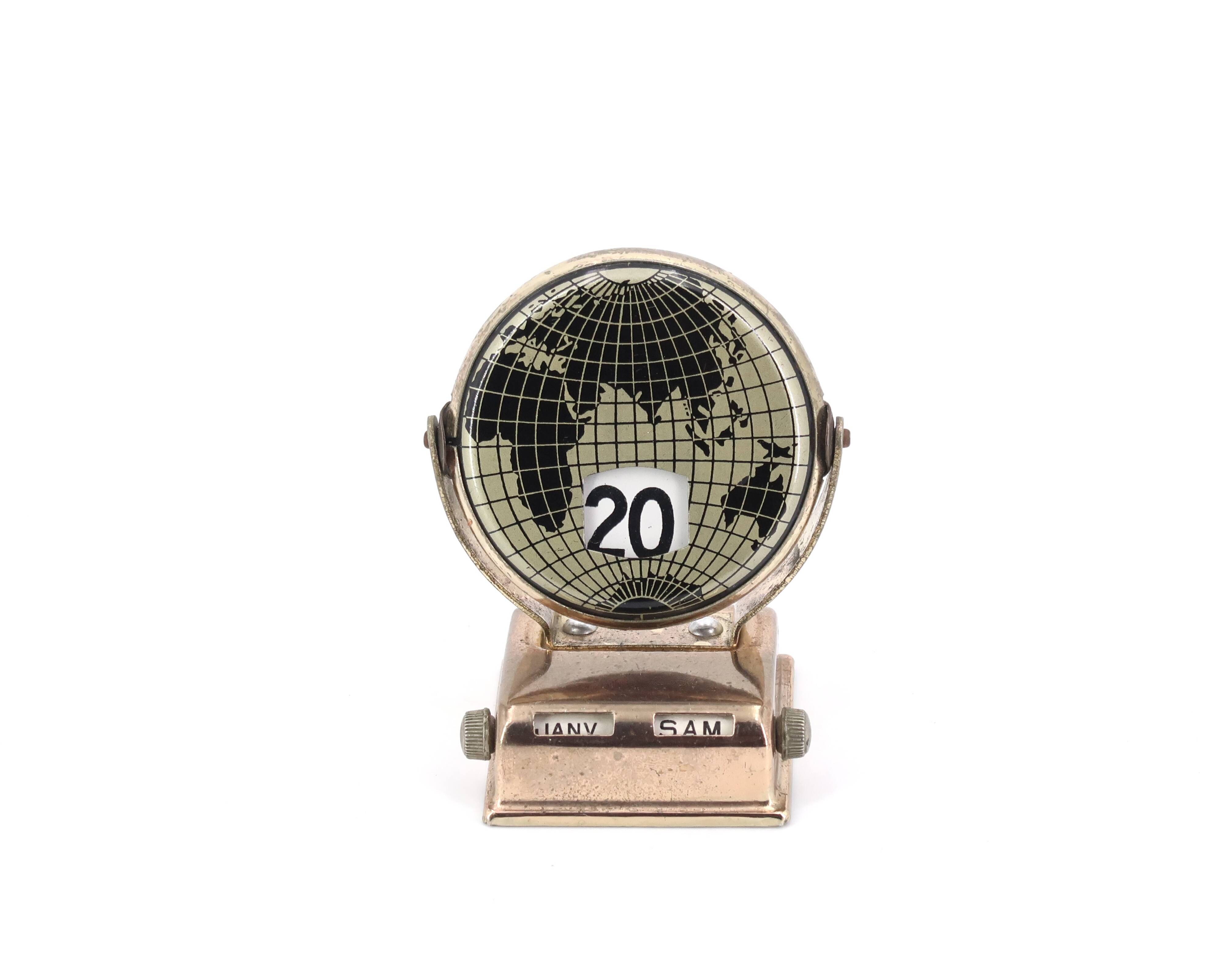 World map perpetual calendar paperweight, 1950s