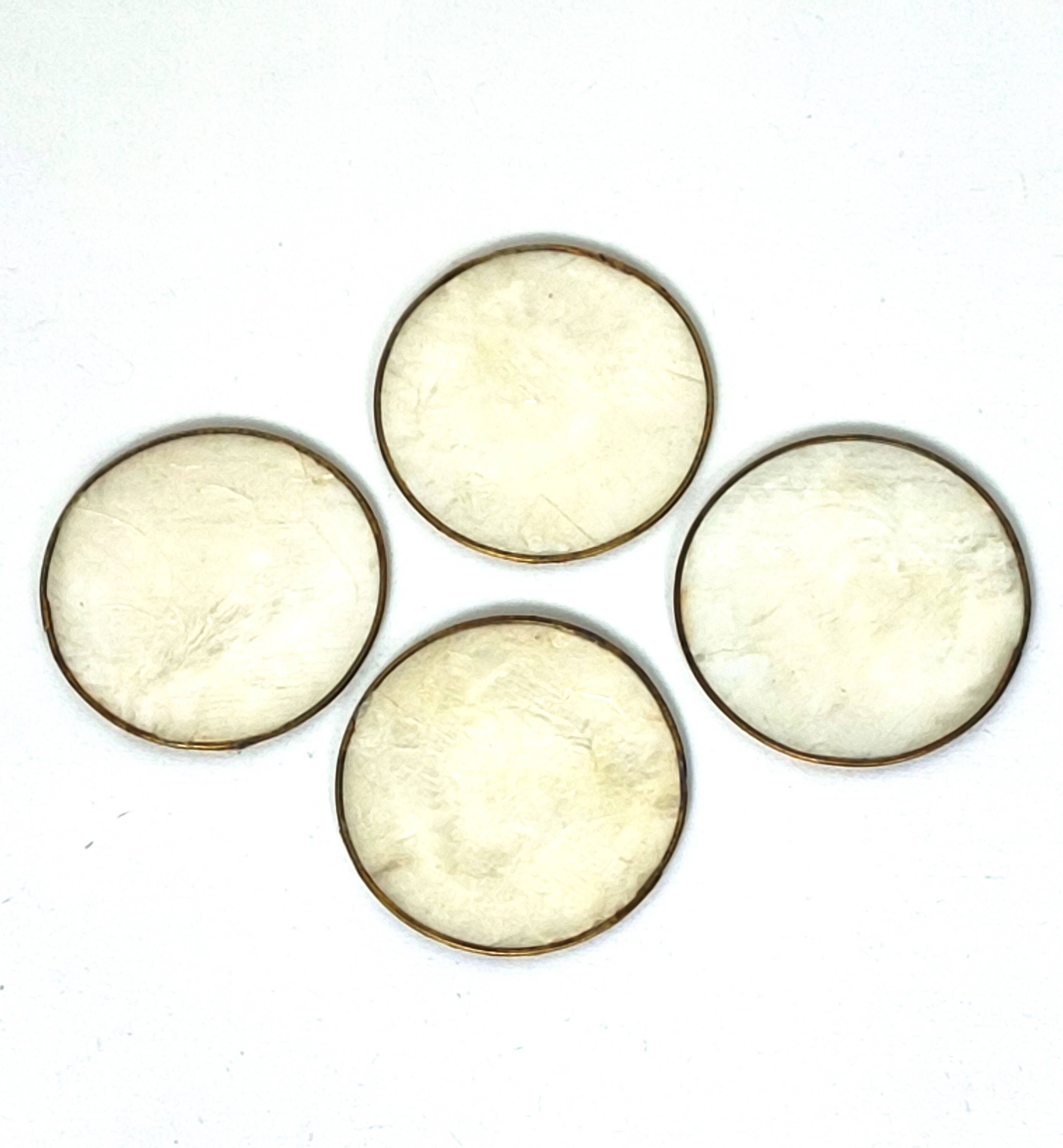 Under mother-of-pearl glasses