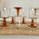 6 small amber stemmed glasses