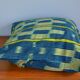 Housse de coussin en tissu baoulé jaune