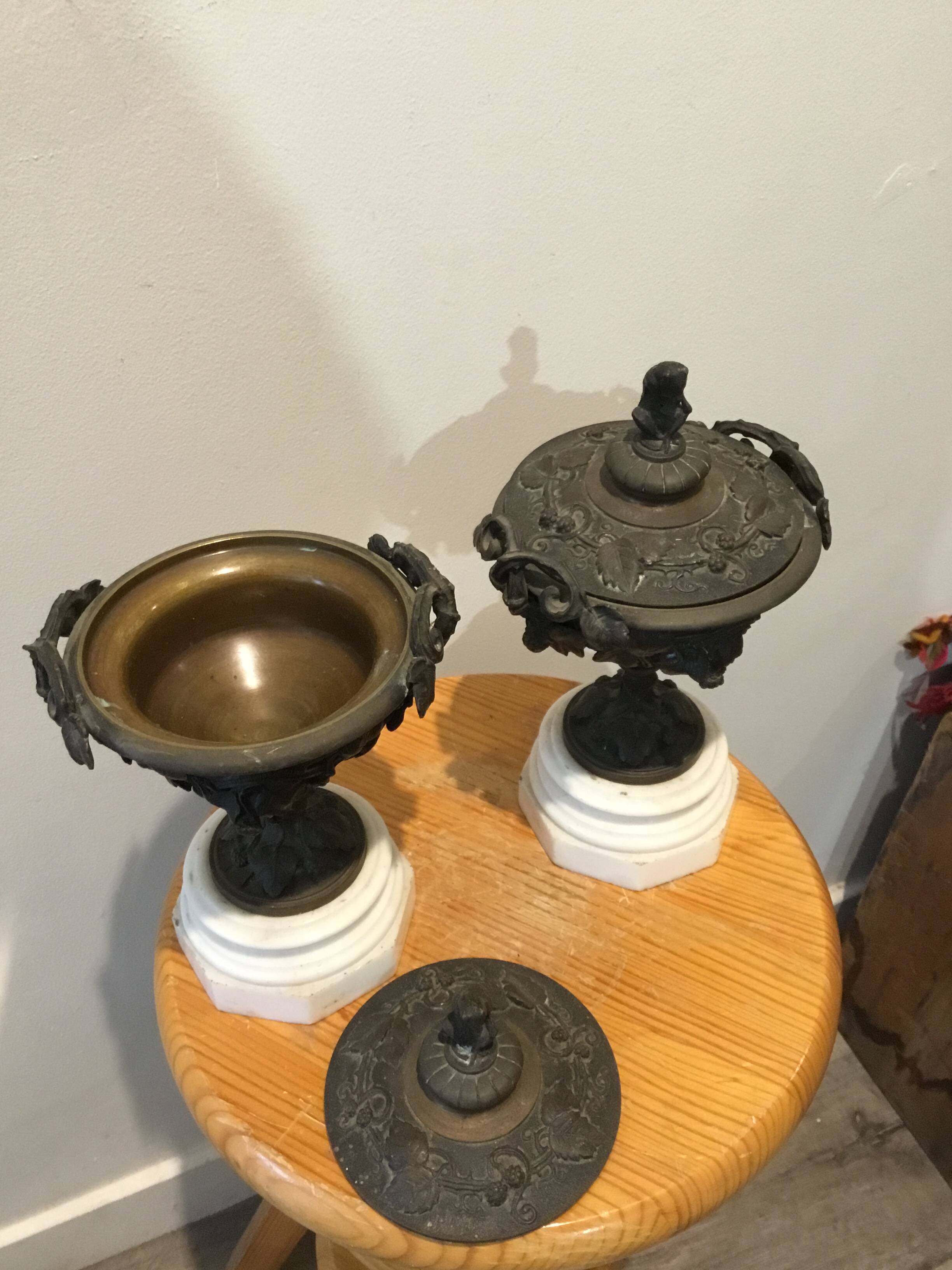 Bronze fireplace garnitures with marble base depicting leaves.