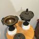 Bronze fireplace garnitures with marble base depicting leaves.