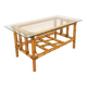 Vintage coffee table in transparent glass and rattan from the 1970s.