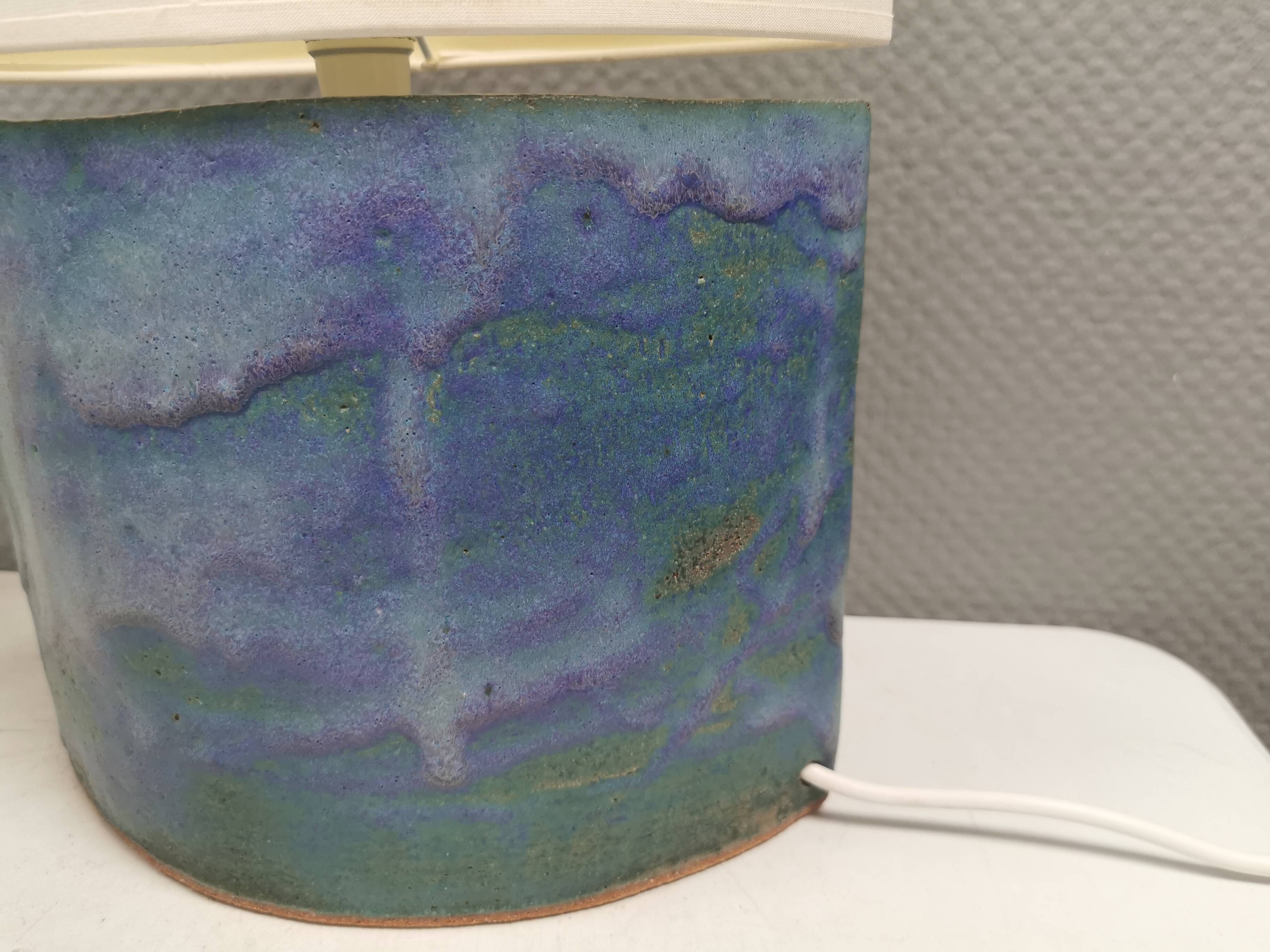 Sculptural table lamp in blue glaze with an abstract expression.